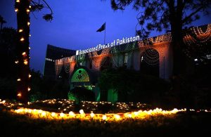 An illuminated view of the Associated Press of Pakistan Headquarters building, decorated with colourful lights in connection with Independence Day celebrations.