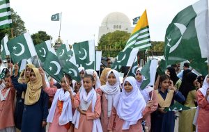 Students wave the national flags at Mazar-e-Quaid on the occasion of observing Youm-e-Istehsal, marking the sixth anniversary of India’s illegal actions of August 5, 2019, in Indian Illegally Occupied Jammu and Kashmir (IIOJK).