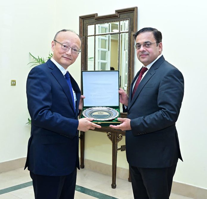 Federal Minister for Economic Affairs, Ahad Cheema, presents a souvenir to Masato Kanda, President of Asian Development Bank