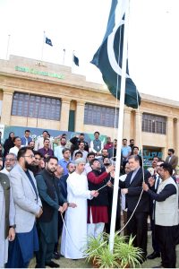 Sindh Governor Kamran Khan Tessori, along with foreign consul generals and others, cuts a cake during a ceremony held at the Governor House to mark Marka-e-Haq and Independence Day celebrations