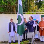 Charge d'Affaires, Salman Mahmood hoisting the national flag in a Flag Hoisting Ceremony in Pakistan House