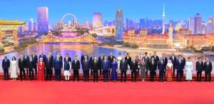 Prime Minister Muhammad Shehbaz Sharif in a group photo at the Tianjin Meijang Convention Center prior to the welcome banquet organized in honor of the world leaders participating in the 25th SCO Heads of States Council Meeting