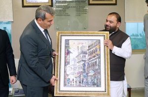 Federal Minister for National Heritage and Culture Division Aurangzeb Khan Khichi presenting a painting to the Ambassador of Azerbaijan Mr Khazar Farhadov.