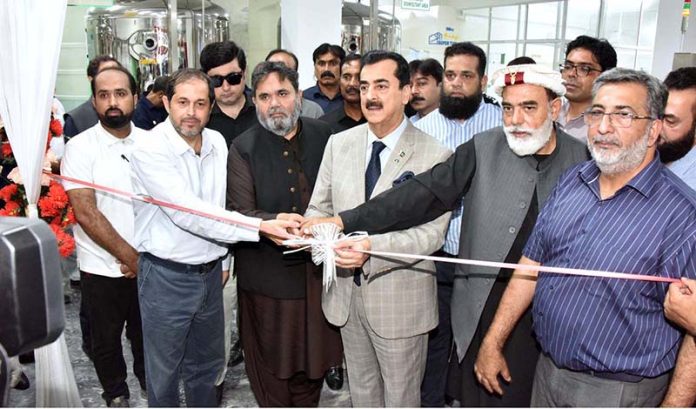 Chairman Senate, Syed Yousaf Raza Gilani, inaugurating Murree Sparkletts RO Plant and water supply line at Hattar Industrial Area