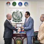 Federal Minister for Defence Production, Muhammad Raza Hayat Harraj, presenting a souvenir to Ambassador of Belgium, H.E. Mr. Charles Idesbald, in Rawalpindi