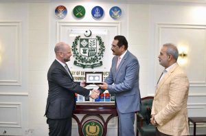 Federal Minister for Defence Production, Muhammad Raza Hayat Harraj, presenting a souvenir to Ambassador of Belgium, H.E. Mr. Charles Idesbald, in Rawalpindi