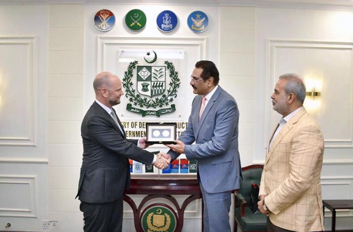 Federal Minister for Defence Production, Muhammad Raza Hayat Harraj, presenting a souvenir to Ambassador of Belgium, H.E. Mr. Charles Idesbald, in Rawalpindi