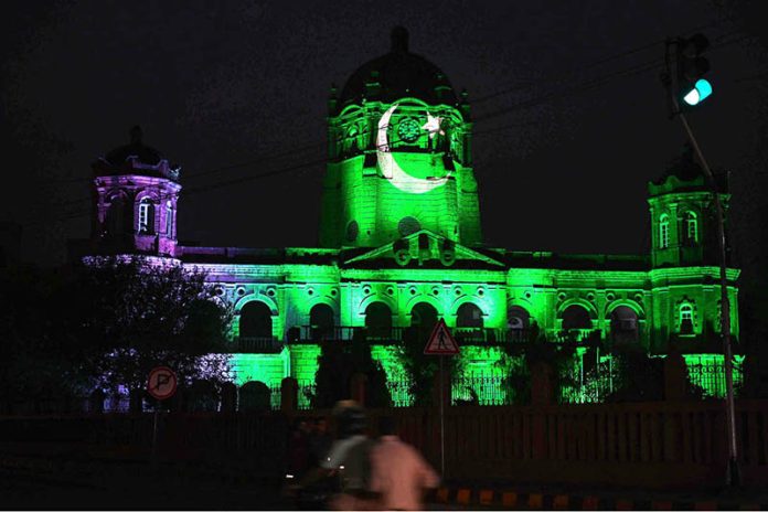 The GPO Building decorated with lights in the colors of Pakistan's national flag to commemorate the country's 78th Independence Day, 'Maarka e Haq'