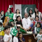 Dr. Majid Abel, Senior Pastor, cutting cake the Independence Day at the Presbyterian Church of Pakistan (Nawlakha)