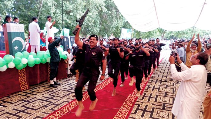 Bahawalpur police presenting march past in a ceremony in connection with the celebration of Independence Day of Pakistan and Maarka e Haq