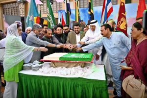 Governor Sindh, Kamran Khan Tessori with foreign counsel generals cutting cake at a ceremony to mark Marka-e-Haq, Independence Day Celebrations" (Shuhda Day) at Governor House