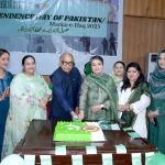 Vice Chancellor GCWUF Prof Dr Kanwal Ameen is cutting a cake during a flag hoisting ceremony organized in Government College Women University Faisalabad (GCWUF) to celebrate Independence Day and Marka-e-Haq