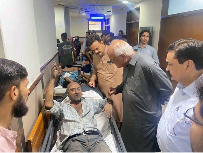 Special Assistant to Sindh CM, Senator Waqar Mehdi, inquiring about the health of injured persons during his visit to the Trauma Centre after the firecracker warehouse explosion at M.A. Jinnah Road