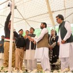 Commissioner Fayaz Abbasi with DC Zainul Abedin Memon hoisting Pakistan national flag during national flag hoisting ceremony during 78th Independence Day and Maarka-E-Haq celebrations at circuit house