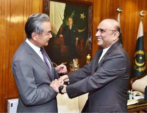 President Asif Ali Zardari shaking hands with Mr. Wang Yi, Member of the Political Bureau of the CPC Central Committee & Minister for Foreign Affairs of China, at Aiwan-e-Sadr