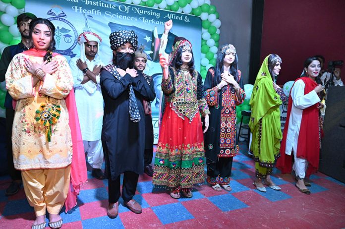 Students performing on national songs during the 78th Independence Day and Maarka e Haq celebration program at Chandka Institute of Nursing & Allied Health Sciences