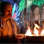 Worshipers lit-up earth lamps at Data Darbar during the 982nd Urs celebration of Data Ali Hajveri while a large number of people arrive to attend the three-day celebrations