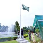 Mr. Saad Ahmad Warraich hoisting a national flag at the flag hoisting ceremony at the Pakistan High Commission