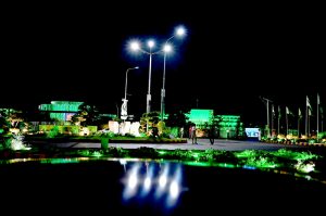 A man captures picture of his children with the well decorated buildings of Aiwan e Sadr and Parliament House in national celebration with the theme of “Maarka-e-Haq” (Struggle for Right) profoundly resonant for Pakistan’s Independence Day