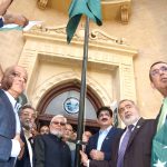 Sindh Chief Minister Syed Murad Ali Shah hoists the national flag at KCCI's restored heritage building to mark Pakistan's 78th Independence Day