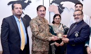 Managing Director Pakistan Bait-ul-Mal Senator Capt. Shaheen Khalid Butt talking to a child after his PBM-funded Cochlear Implant Surgery at CMH