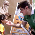 Sindh Chief Minister Syed Murad Ali Shah gently greets a differently-abled girl during his visit to a stall at the Grand Festival for Special Children, organised by the DEPD at Al-Noor Park, Clifton