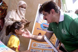 Sindh Chief Minister Syed Murad Ali Shah gently greets a differently-abled girl during his visit to a stall at the Grand Festival for Special Children, organised by the DEPD at Al-Noor Park, Clifton