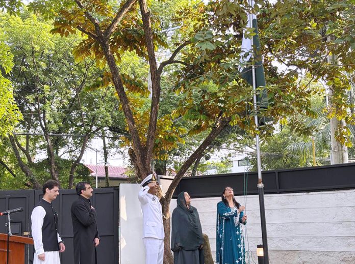 Ambassador Dr. Asima Rabbani hoisting flag on the occasion of Independence Day of Pakistan