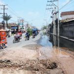 Stagnant sewage water after overflow create a deep hole on Millat Road, choking traffic flow and spotlighting glaring civic negligence
