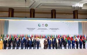 Prime Minister Muhammad Shehbaz Sharif in a family photo at the emergency Arab-Islamic Summit in Qatar.