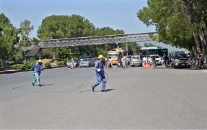 IESCO workers are busy installing new electric wires on poles along the Islamabad Expressway near Zero Point