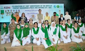Students present patriotic tableaus and pay rich tributes to the martyrs during celebrations of the 15th anniversary of the birth of Prophet Muhammad (PBUH) and Defence Day 2025 at Jinnah Hall, organized by Women University