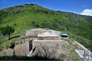 The name "Ban Faqiran" is derived from the local vernacular: "ban" (meaning reservoir) and "faqiran" (meaning saints), thus translating to "a reservoir dedicated to saints." The archaeological site, known locally by this name, is situated approximately two kilometers southwest of the Shah Allah Ditta Caves. The Buddhist stupa at Ban Faqiran dates from the 2nd to the 5th century C.E. The complex, which includes the stupa and a long staircase, covers an area of 10.15 by 26.20 meters. It was constructed using local limestone and Kanjur stone. Presently, the Ban Faqiran stupa is the largest historical Buddhist monument discovered in Islamabad. In addition to the stupa's structural remains, a variety of artifacts such as coins, pot shards, and arrowheads have been discovered at the site. The coins date from the 1st century B.C. to the late Mughal period. These artifacts are currently displayed at the Islamabad Museum, located at G-5/1 Attaturk Avenue
