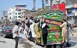 People travelling on a passenger bus in a risky way at Lehtrar Road may cause any mishap and needs the attention of concerned authorities