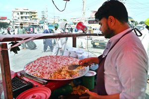 A vendor selling ‘fruit chaat’ at Faizabad.