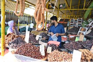 A vendor sells seasonal fruit at his stall in weekly Sunday Bazaar in G-6 Sector in the Federal Capital