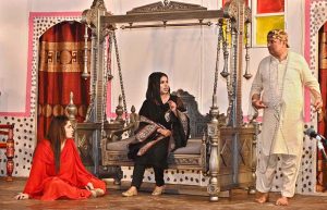 Artists are performing on stage during the drama "Kachi Mitti Ke Log" at the Sargodha Arts Council, in collaboration with Burhan City.