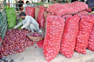 A vendor sells seasonal fruit at his stall in weekly Sunday Bazaar in G-6 Sector in the Federal Capital
