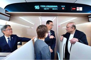 President of Pakistan, Asif Ali Zardari being briefed on the operations of the high-speed train during his journey from Chengdu to Mianyang.