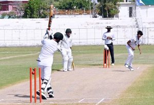 Players in action during a cricket match between Comprehensive Boys Higher Secondary School and Beaconhouse School teams as part of the Inter-School PCB Talent Hunt Program at Niaz Cricket Stadium.