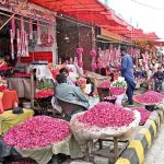 Vendors display and sells fresh flowers to attract customers at 47 adda.