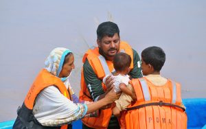 Rescue 1122 officials are engaged in the evacuation of people stranded by the rising floodwaters of the River Chenab.