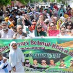 Teachers of different government schools participating in a rally in connection with 6th September Defense and martyrs Day of Pakistan at Press Club Road