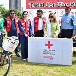 Chairperson Pakistan Red Crescent Society (PRCS), Mrs. Farzhana Naek distributing cycles to PRCS volunteer persons during Zero Emission Day "Pedal For The Planet" Cycling Rally at Jinnah Avenue near China Chowk to National Press Club