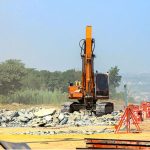 Labourers are busy construction work of the T-Chowk Flyover, which is part of the ongoing development work