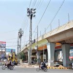WAPDA staffers busy in repairing electricity wire during maintenance work at Chungi No.9