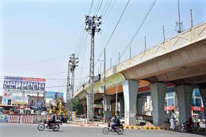 WAPDA staffers busy in repairing electricity wire during maintenance work at Chungi No.9