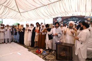 Peer Muhammad Badar e Alam jan offers Dua during the Eid Milad Un Nabi (PBUH) procession at G-7