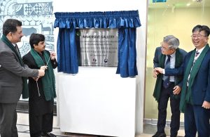 Minister of State for National Heritage & Culture Division Huzifa Rehman unveiling plaque during opening ceremony of Digital Immersive Gallery at Islamabad Museum