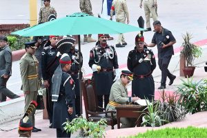 Corps Commander Lahore Lieutenant General Fayyaz Hussain Shah, HI (M), writes his remarks on the book after laying a wreath at Mazar e Iqbal